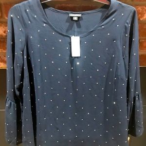 Black pullover blouse with studs on front.
